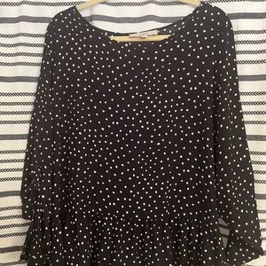 Polka dot blouse with a ruffle trim